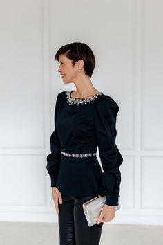 A refined statement piece. This elegant fashion moment features long, cuffed, oversized sleeves, while princess seams at the back ensure a tailored look. All embellishment details are hand sewn. Pinky out, darling. Elegant Evening Blouse With Structured Shoulders, Elegant Party Blouse With Structured Shoulders, Elegant Blouse With Structured Shoulders For Party, Elegant Formal Blouse With Structured Shoulders, Elegant Evening Blouse With Pleated Sleeves, Party Blouse With Structured Shoulders And Long Sleeves, Evening Blouse With Structured Shoulders And Long Sleeves, Fitted Bishop Sleeve Blouse For Evening, Evening Blouse With Gathered Bishop Sleeves