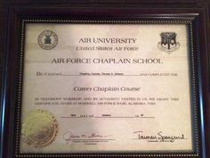 an air force chaplain's school certificate is displayed in a framed frame on the wall