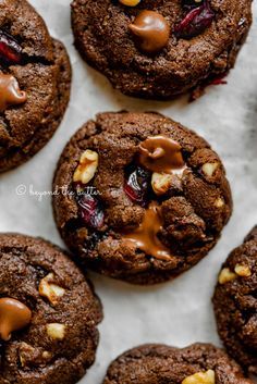 chocolate cookies with peanut butter and cranberries on top