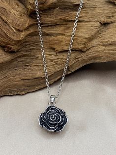 Keep the memory of your loved one alive with this beautiful Rose Flower Cremation Urn Necklace. This Memorial Jewelry piece is designed to hold a small portion of human ashes, allowing you to keep a part of your loved one close to your heart always. Crafted with high-quality stainless steel material, this Rose Flower Cremation Urn Necklace features a beautifully designed rose flower pendant that symbolizes love and affection. The pendant opens to reveal a cylinder-shaped compartment that can hold a small amount of ashes or other keepsake items such as hair or dried flowers. This necklace is designed specifically for women and makes for a beautiful and elegant accessory. It is also a unique way of keeping your loved one's memory alive and close to your heart. This Memorial Jewelry piece can Rose Shaped Urn Necklace Sterling Silver, Rose Locket, Flower Urn, Ashes Necklace, Cremation Necklaces, Urn Pendant, Urn Jewelry, Urn Necklace, Urn Necklaces