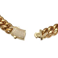 The Pave Clasp Miami Cuban Link Chain. Featuring a large and distinctive rectangular box clasp, encrusted with clear stones that create a dazzling shine. This substantial piece makes a statement, adding a touch of opulence to any outfit. PVD Plating guarantees a long-lasting finish Elegant Cuban Link Bling Chain Necklace, Elegant Cuban Link Chain Necklace With Bling, Chunky Chain Link Cubic Zirconia Jewelry, Elegant Cuban Link Rhinestone Necklaces, Elegant Rhinestone Cuban Link Necklaces, Elegant Cuban Link Necklace With Rhinestones, Elegant Rhinestone Cuban Link Necklace, Rectangular Gold Diamond Jewelry, Luxury Chain Link Jewelry With Bling