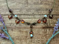 This necklace is a beautiful mix of bronze metal and orange brown beads. The metal is bronze alloy so keep away from high moisture areas. The necklace length is between 16-17 inches. Whimsigoth Fall, Fall Maple Leaves, Autumn Necklace, Bronze Metal, Maple Leaves, Beaded Necklaces, Orange Brown, Necklace Length, Maple Leaf