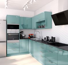 a kitchen with blue cabinets and black counter tops is shown in this image, there are two televisions on the wall above the stove