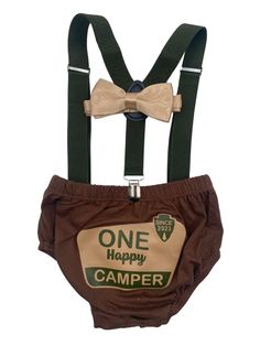 a brown and green suspender with a bow tie on it's chest, which says one happy camper