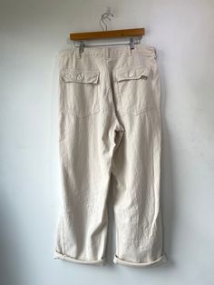 Japanese Workwear Wide Leg Cream Canvas Pants. Comfortable cotton fabric and wide leg design. An elevated staple piece for your closet. Features two pockets on front and two buttoned pockets on back. In excellent condition. Best fits Size L-XL but can be worn oversized. Approx Measurements: Waist: 17" Inseam: 35" Straight Cotton Pants With Multiple Pockets, Cotton Straight Pants With Multiple Pockets, Oversized Wide Leg Utility Pants, Baggy Cotton Utility Work Pants, Cotton Wide Leg Work Pants With Welt Pockets, Cotton Wide-leg Work Pants With Welt Pockets, Cotton Straight Parachute Pants With Pockets, Utility Cotton Work Pants With Loosely Fitted Hips, Wide Leg Cotton Work Pants With Welt Pockets