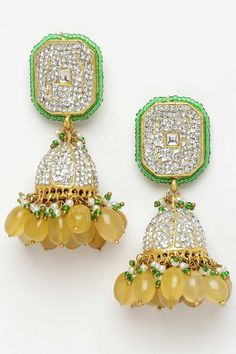 Yellow & Green Jhumkas Earring With Kundan & American Diamonds Product Features: Color: Yellow, Green, Gold, White Material: Metal Work: Kundan, American Diamonds, Pearls, Natural Stones, Faux Yellow Sapphire Plating: Gold-Plated Closure: Insert Closure And Closure Stopper And Kanchain Adjustable: No Dimension: Length Of Earring= 8.1 Cm; Width Of Earring =2.7 Cm; Adjustable - No Package Contain: 1 Pair Earring Occasion: Party Product Type: Jhumka Dangling Disclaimer: There Will Be Slight Differe Festive Green Jhumkas With Gota Work, Festive Green Gota Work Jhumkas, Green Meenakari Jhumkas For Party, Green Cutdana Jhumkas For Party, Green Gota Work Jhumkas For Diwali, Green Cutdana Jhumkas For Celebration, Temple Style Zari Work Jhumkas For Parties, Celebration Green Cutdana Jhumkas, Green Jhumkas For Festivals And Celebrations