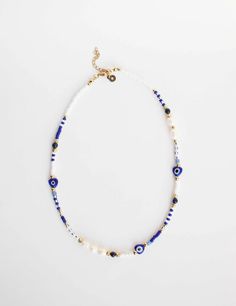 This has become our fastest selling necklace and it's easy to see why. Our beautiful Evil Eye and sweet water pearl necklace is simple and bold. The evil eye symbol is used throughout cultures as a symbol of protection against negative energies. Macramé style necklace Blue Evil Eye Charms Fresh Water Pearls Steel Lobster Claw Clasp 100% handmade, therefore slight variations may occur White Bohemian Beaded Necklace With Evil Eye, Bohemian White Beaded Necklace With Evil Eye, Adjustable White Beaded Necklace With Evil Eye, White Bohemian Necklace With Evil Eye, Bohemian White Necklace With Evil Eye Detail, Bohemian White Evil Eye Necklace, White Evil Eye Jewelry For Festivals, Bead Evil Eye, Blue Evil Eye Necklace