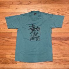 Vintage Stussy T Shirt From The Late 80’s To Early 90’s. Very Rare. As Seen On Travis Scott. In Pristine Pre-Owned Conditon. La Miami Houston Dallas New York City Streetwear Aime Leon Dore Hype Hypebeast Single Stitch Men’s Women’s Y2k 2000s Oversize Distressed Reseller Cool Rare Nyc Casual Deadstock Shirt For Streetwear, 90s Style Green Shirt For Streetwear, Stussy T Shirt, City Streetwear, Vintage Stussy, Leon Dore, Aime Leon Dore, Travis Scott, Y2k 2000s