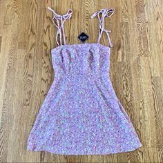 Nwt New Zaful Medium Purple Sleeveless Dress Tie Shoulder Floral Flower Mini Sundress. Zips Up The Back. Casual Mini Sundress With Adjustable Straps, Spring Floral Print Sleeveless Mini Dress, Sleeveless Floral Mini Dress For Spring, Sleeveless Tie-back Mini Dress For Summer, Sleeveless Cotton Mini Dress With Tie Back, Sleeveless Purple Dress With Adjustable Straps, Purple Floral Print Sleeveless Beach Dress, Purple Floral Print Sleeveless Dress For Beach, Purple Floral Sleeveless Beach Dress