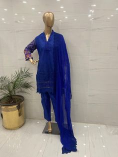 Fabric:   lawn   3 pc shirt trouser dupatta  Shirt: Embroidered chicken kari  shirt  beautifully embroidered chicken kari daman printed embellished sleeves , printed  back  embroidered  chiffon duptta  Plain trouser Measurement  🧵  medium 👗  Shoulder: 15  Chest: 40 Waist: 46 Sleeves length: 18 Shirt length: 38  Aramhole: 9.5  Trouser length: 37  Large 👗  Shoulder: 15  Chest: 46  Waist: 49 Sleeves length: 19 Shirt length: 40  Aramhole: 10.5  Trouser length:  37 Semi-stitched Naqshi Palazzo Set With Straight Kurta, Naqshi Jamawar Straight Kurta Set, Blue Cambric Palazzo Set For Eid, Festive Blue Palazzo Set In Cambric, Eid Blue Cambric Palazzo Set, Festive Blue Cambric Palazzo Set, Blue Straight Kurta Lawn Suit In Mulmul, Blue Mulmul Lawn Suit With Straight Kurta, Blue Cambric Anarkali Kurta