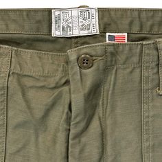 Early 60's OG-107 GI chino with Japanese reproduction 12 oz baker back cotton Satin. One of the most famous military pants through history with a beautiful vintage looking finish in a soft Satin Cotton Fabric. High rise with long button front fly, wide leg, front and back patch pockets, Hollywood waistband, vintage reproduction military buttons. Note, due to the high rise you will need a much smaller inseam. Compare your typical front rise length with these and subtract the difference from your Vintage Cotton Cargo Pants With Patch Pockets, Vintage Cotton Cargo Pants With Belt Loops, Vintage Cotton Cargo Pants With Welt Pockets, Military Pants, Back Patch, Chain Stitch, Modern Fit, Patch Pocket, Wide Leg