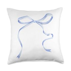 a white pillow with a blue ribbon on it