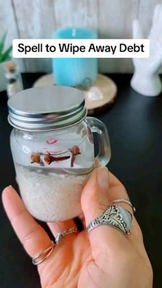 a person holding a jar filled with white stuff