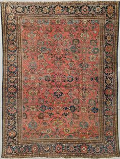 an antique rug with many different colors and designs