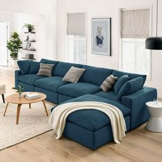 a living room filled with furniture and a large blue couch