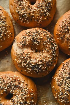 several bagels with sesame seeds on top