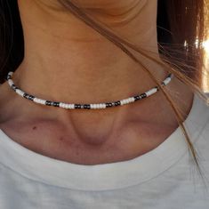 This is a 14 inch necklace using Czech 8/0 Opaque Grey Luster, Iris Sphinx and Opaque white ceylon seed beads. It is finished off with a silver plated lobster clasp and jump rings.  If you have a preference for a different length, just ask. I can always create one just for you. This necklace looks great on its own or layered with other necklaces. Also great for everyday wear. To maintain quality of necklace, keep dry(do not wear while swimming, showering, etc.) and avoid contact with moisture, p Handmade White Heishi Beads Choker, White Tiny Beads For Jewelry Making, White Small Beads For Jewelry Making, White Tiny Beaded Necklaces For Jewelry Making, White Round Heishi Beads Jewelry, Minimalist Handmade White Beads, White Heishi Beads Necklace With Spacer Beads, Handmade White Heishi Beaded Necklaces, Silver Heishi Spacer Beads