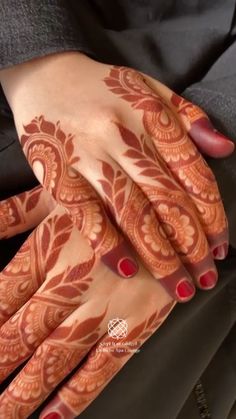 the hands and feet of a woman are decorated with henna designs on their palms