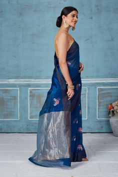 Elegant blue Pattu silk sari with zari border makes a perfect drape for special occasions. It is adorned with floral zari motifs and comes with a matching blouse piece. Disclaimer: The shown stitched blouse on the model is for display purpose only. The saree comes with a matching blouse piece and finished with fall and piko. Indigo Chanderi Traditional Wear For Wedding, Festive Indigo Chanderi Traditional Wear, Blue Cotton Silk Pre-draped Saree For Diwali, Indigo Chanderi Traditional Wedding Wear, Blue Cotton Silk Dupatta For Transitional Season, Transitional Blue Cotton Silk Dupatta, Indigo Traditional Wear With Zari Work For Transition Season, Blue Silk Anarkali Pre-draped Saree, Festive Indigo Traditional Wear With Cutdana