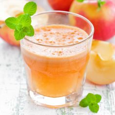 an apple cider is garnished with fresh mint