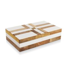 a wooden box sitting on top of a white surface with brown and beige squares in it