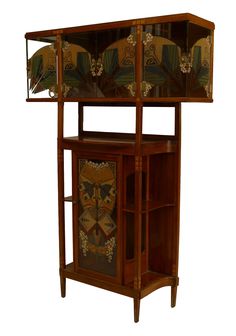 an antique wooden display case with decorative designs on the front and side panels, all in wood