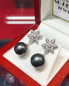 "EXTREMELY SHINY, AUTHENTIC LUSTROUS BLACK TAHITIAN PEARLS! Dangling earrings! Perfect for any occasion! We are presenting you A PAIR OF matching TAHITIAN PEARLS with natural, LUSTROUS BLACK color. SET IN HANDCRAFTED, 18K SOLID GOLD DROP EARRINGS. ACCENTED WITH 38 F/VS, SPARKLING ROUND BRILLIANT DIAMONDS! Extremely elegant and tasteful! The pearls are so lustrous and shiny! The design is chic and elegant. Simple and classy! Dangling with just enough length to show that you're important! With spa Elegant Tahitian Pearl Earrings For Wedding, Tahitian Pearl Round Earrings For Wedding, Luxury Silver Tahitian Pearl Earrings, Round Tahitian Pearl Earrings For Wedding, Elegant Gray Jewelry With Matching Earrings, Luxury Tahitian Pearl Wedding Earrings, Elegant Gray Earrings For Wedding, Elegant Tahitian Pearl Wedding Earrings, Elegant Gray Jewelry For Anniversary