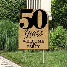 a sign that says 50 years welcome to the anderson's anniversary party