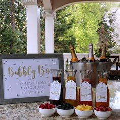 bottles of booze and fruit on a table