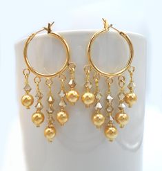 GOLDEN AUSTRIAN Crystal Pearls Crystals Chandelier Earrings,  Golden Chandelier Earrings Golden Crystals Chandelier Earrings Beautiful Austrian bicone crystals and crystal pearls in a luscious golden color. For spacers, I used tiny gold seed beads. The gold-finished hoop has five loops. These are very lovely crystal hoop earrings to add to your collection.   Earring dimensions: The hoop is a tad over 3/4" in diameter. The total length of the earrings is 2" Preciosa Austrian 4mm golden faceted, r Luxury Yellow Gold Chandelier Earrings For Festive Occasion, Golden Chandelier, Earrings Golden, Crystal Chandelier Earrings, Crystal Hoop Earrings, Crystal Pearls, Austrian Crystal, Golden Color, Crystal Chandelier