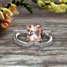 an engagement ring with a pink morganite surrounded by diamonds