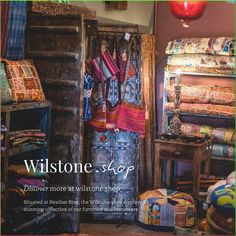 the front cover of a magazine with an image of clothes hanging on a rack and other items