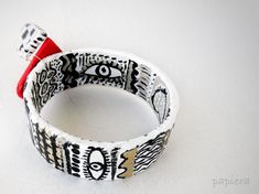 papier mache bracelet,bangle,free shipping,paper jewelry,eco friendly,red,black,white,heart,love,wonderland,hand painted,art jewel, bangle. Papier mache art jewelry by Papiera. Round strong cardboard for the base covered with a lot of paper and glue layers.  I really enjoyed painting this bracelet!  Perfect jewel for every occasion. Makes your day  the wire is silver 925  Water from rain and regular hand washing will not hurt it, but please don't place it under a running tap. For more papier mache jewelry, see here: https://www.etsy.com/shop/papiera?section_id=15353109 Diameter inside: Approximately 7cm  (2,75 inches) Length outside: Approximately 3 cm (1,18 inches)  . Contact me for any question. It will be a pleasure for me to answer. Papier Mache Art, Mache Art, Black And White Heart, Paper Jewelry, Hand Painting Art, Bracelet Bangle, Heart Love, White Heart, Art Jewelry