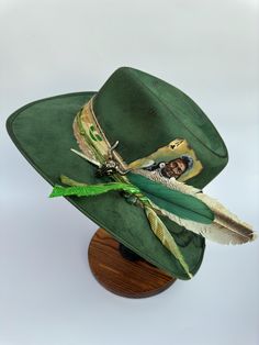 This hat has so much personality. It is an beautiful green with burnt design and vintage embellishments. This hat is a size large with an elastic inner band for the most comfortable fit. Please see size chart in the pictures. Adjustable Wide Brim Green Felt Hat, Adjustable Green Wide-brim Fedora, Adjustable Green Wide Brim Fedora, Green Adjustable Wide Brim Fedora, Green Short Brim Felt Hat For Kentucky Derby, Bohemian Green Hats For Rodeo, Green Bohemian Hat For Rodeo, Green Fedora For Kentucky Derby, Green Bohemian Rodeo Hat