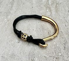 This wrap leather bracelet is handmade to order by me using real leather cord - 2mm, gold colour bead and gold colour clasp.  📌HOW TO CHOOSE YOUR BRACELET SIZE: - Using a flexible measuring tape, measure the smallest part of your wrist (the wrist joint, where your arm connects to your hand) - Ensure that it is tight around your wrist  - Add 0.25 inches for comfort - This is your bracelet size  Bracelet sizes are very individual and different for everyone and it is important to make sure that th Adjustable Leather Bracelet With Gold Clasp, Yellow Gold Leather Bracelet As Gift, Yellow Gold Leather Bracelet Gift, Adjustable Gold Leather Bracelet For Everyday, Adjustable Yellow Gold Leather Bracelet, Yellow Gold Leather Bracelets For Gift, Gold Minimalist Leather Bracelet, Minimalist Gold Leather Bracelet, Adjustable Gold Minimalist Wrap Bracelet