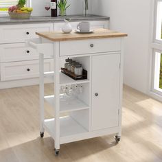 a kitchen island cart with wine glasses on it