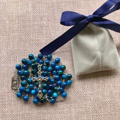 "Catholic Rosary Beads Necklace. Made and blessed in Jerusalem Holy Land Bead color: navy / multicolor Cross color - silver tone Drop length - Approximately 22\"-22.4\" ( 56-57 cm ). Approximate crucifix size -1.75\"x1\" Comes in a pouch as pictured. Silver tone metal Catholic Crucifix Cross with beautiful double sided center piece. If you have any questions, feel free to ask us. We are based in Florida and ship packages every business day very Fast and absolutely FREE! God Bless You and Your Fa Gift Of Blue Polished Beads, Blue Beaded Rosary As A Gift, Adjustable Blue Beaded Rosary, Blue Beaded Necklaces For Jewelry Making (8mm Beads), Blue Beaded Necklaces With 8mm Beads As Gift, Blue Rosary With Round Beads For Gift, Adjustable Rosary With Large Beads As Gift, Colorful Beads Rosary As Gift, Adjustable Large Beads Rosary As Gift