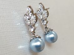 Wedding Light Blue Blush Blue Pearl Drop Cubic Zirconia Silver Dainty Bridal Earrings. EARRINGS are 1.06 inch (2.7cm) long from top of erring stud to bottom. MATCHING BRACELET Pic.#7): https://www.etsy.com/listing/892586384/blue-pearl-wedding-bracelet-swarovski?ref=shop_home_active_9&sca=1 Elegant and timeless, these dainty earrings are perfect for weddings or special occasions such as birthdays, anniversaries, graduations, proms...or whatever you can imagine! Handmade earrings, are made wit Blue Round Bridal Earrings For Formal Occasions, Elegant Blue Teardrop Bridal Earrings, Elegant Light Blue Teardrop Jewelry, Elegant Blue Pearl Earrings For Anniversary, Light Blue Jewelry For Wedding, Blue Pearl Drop Bridal Earrings For Wedding, Blue Pearl Drop Bridal Earrings As Gift, Blue Dangle Bridal Earrings With Pearl Drop, Elegant Blue Pearl Drop Bridal Earrings