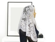 Vintage, Chapel Spanish Mantilla is made of a  high quality  very light french lace. Color -White This mantilla is very elegant with a feminine look. It measures 44" X 23" Check this mantilla in other veil available in our store You can purchase the sewn snap comb to secure mantilla in place and prevent from slipping https://www.etsy.com/listing/825065625/add-a-snap-comb-sewn-to-your-veil-veil?ref=shop_home_active_1&frs=1 Some of our veils/mantillas are already made ready to ship and some are cu Elegant Fitted Veil With Lace Trim, Elegant White Lace Veil, Elegant White Scalloped Lace Veil, Elegant White Lace With Contrast Detailing, White Fitted Lace Veil, Fitted White Veil, Fitted White Lace Veil, Mass Veil, Veil Scarf