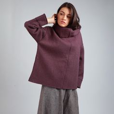 Oversized wool sweater with a high split turtleneck. drop shoulder wide dolman sleeves. Side splits for added movement. Accent overlapping stitches and hems. Made of pure, soft, luxurious boiled wool fabric. Hand sewn to measure in our local studio in Sibiu, Romania.  Shown in color Purple.  FEATURES * Relaxed, slouchy silhouette * Mid-hip length * Drop shoulder dolman sleeves * High split stand up collar * Unstructured, unlined construction * Crafted from soft OEKO TEX certified boiled wool fab Plus Size Jumper, Boiled Wool Fabric, Plus Size Jumpers, Plus Size Pullover, Spring Sweater, Boiled Wool, Kimono Sleeve, Style Expert, Wool Fabric