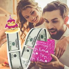 a man and woman looking at money in front of a cake