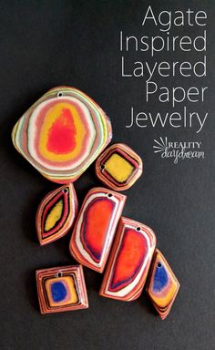 an image of some colorful paper jewelry on a black background with the words, agate inspired layered paper jewelry