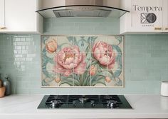 a tile backsplash with pink flowers on it