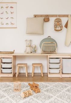 a wooden shelf with toys on top of it in a child's playroom