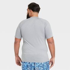 Stay comfortable in or on the water with the Regular Fit Long-Sleeve Rash Guard Swim Shirt from Goodfellow & Co™. This men’s rash guard features a regular fit with a solid hue for a no-nonsense look that’s perfect for hot days on the water. It’s made from soft fabric with added spandex for improved mobility and comfort, while UPF 50+ sun-blocking protection helps keep your skin safe from harmful sun rays. Whether you’re wading through the water or relaxing on the boat, this solid-color rash guar Swim Shirt, Beach Adventure, Sun Shirt, Swim Shirts, Sun Rays, Slim Fit Shorts, The Boat, Short Shirts, Hot Days