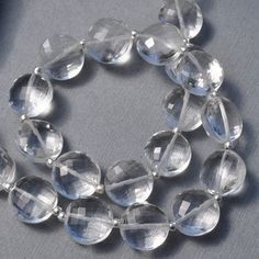 Please visit my new website for more gemstone selections and special discount pricing: www.mygemmestones.com Item Description Material: Natural Quartz Color Tones: Clear Cut: MicroFaceted Coin Drilled: Center - should accommodate 24-26g wire Size: approx. 9.5mm - 10mm Quantity: see options in drop down menu *these beads will be divided into sets that are similar in size and shape* Quartz Color, Quartz Colors, Clear Quartz Crystal, New Website, Colour Tone, Clear Quartz, Quartz Crystal, Gemstone Beads, Coin