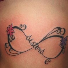 a woman's stomach with a tattoo on it that says, sisters and two hearts