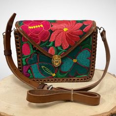 "Beautiful colorful Hand Embroidered Mexican Flower Bag made in Chiapas, Mexico. Each bag is hand embroidered and flower will vary but each one is beautiful and unique Adjustable Strap 7\" Tall 8\" Wide" Spring Multicolor Shoulder Bag With Floral Embroidery, Multicolor Floral Embroidery Shoulder Bag For Travel, Multicolor Floral Embroidered Shoulder Bag For Travel, Green Rectangular Shoulder Bag With Floral Embroidery, Spring Multicolor Floral Embroidery Shoulder Bag, Spring Multicolor Floral Embroidered Shoulder Bag, Multicolor Floral Embroidery Crossbody Shoulder Bag, Multicolor Embroidered Floral Crossbody Shoulder Bag, Multicolor Embroidered Shoulder Satchel