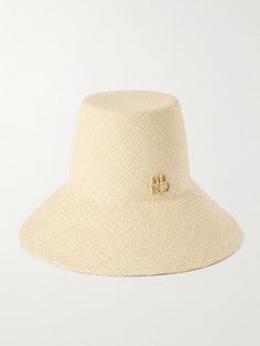 The elongated crown on Ruslan Baginskiy's bucket hat instantly sets it apart from other styles. Hand-woven from natural straw, it has a wide brim and the designer's initials decorating the front. Luxury Wide Brim Summer Bucket Hat, Luxury Wide Brim Bucket Hat For Summer, Luxury Toquilla Straw Hat, Spring Straw Bucket Hat, Chic Natural Bucket Hat, Chic Natural Color Bucket Hat, Spring Bucket Straw Hat, Summer Bucket Hat In Straw, Vacation Bucket Hat With Woven Detail