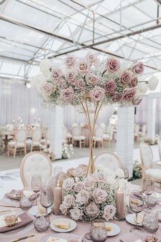 an elegant table setting with pink and white flowers